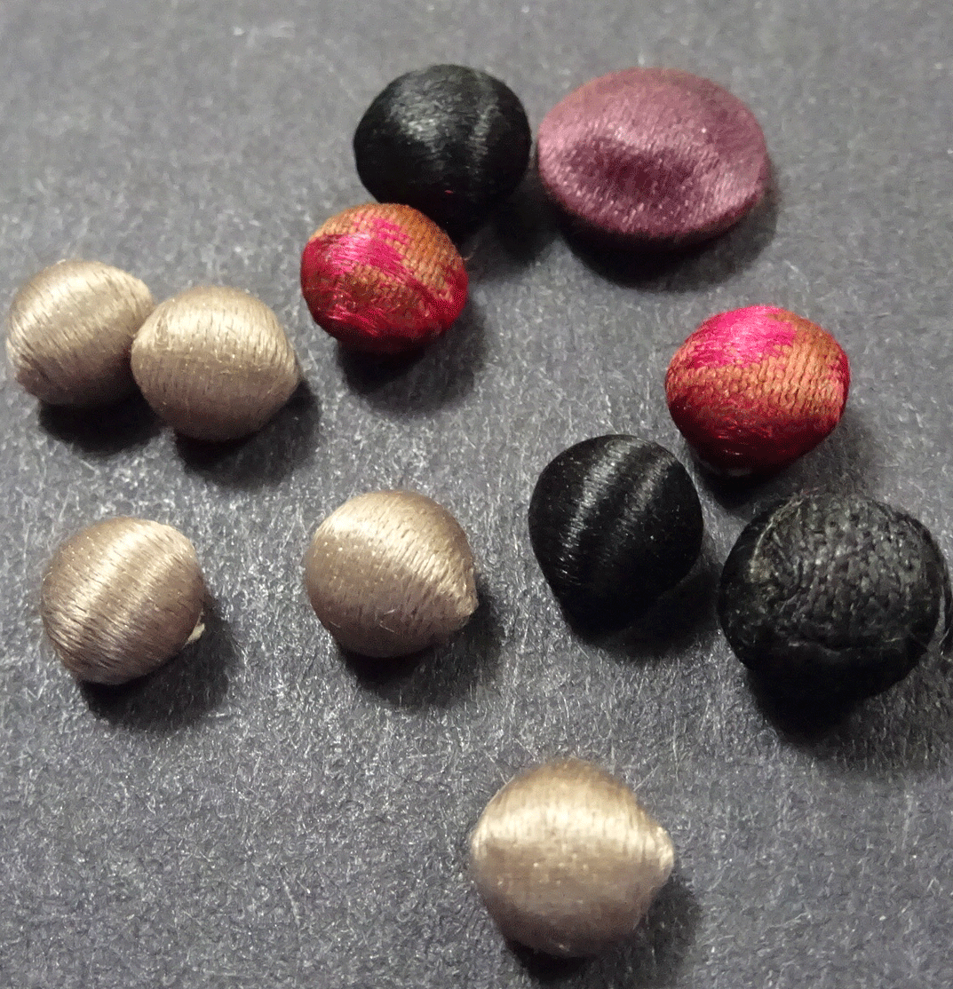 Set of 11 tiny dolls size fabric buttons