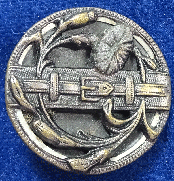 Tinted brass button with flowers and strap buckle