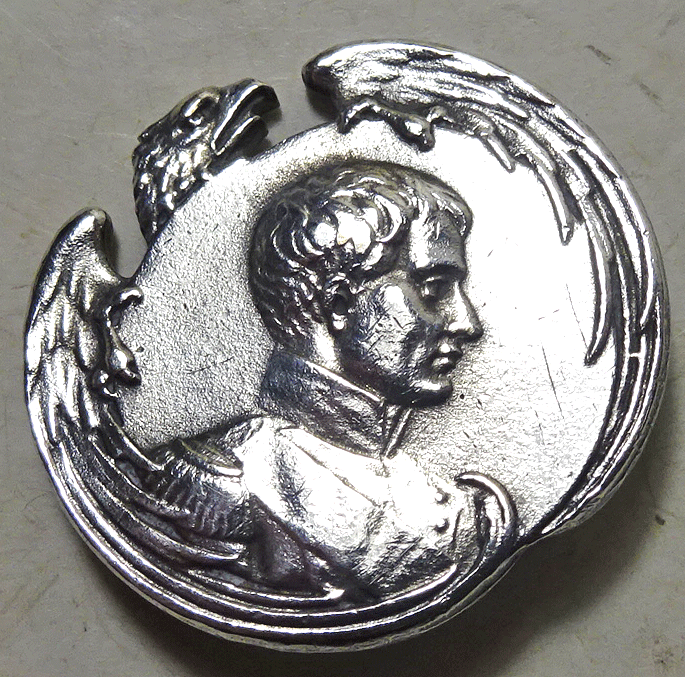 Head of Napoleon, with eagle border