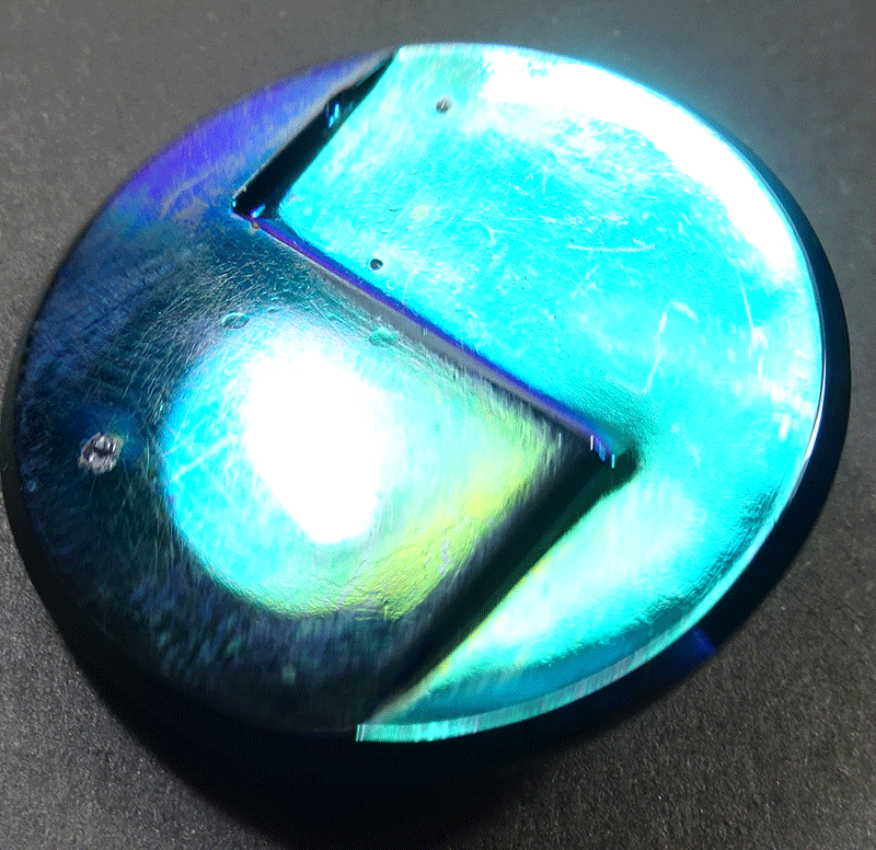 Black glass with turquoise/green lustre
