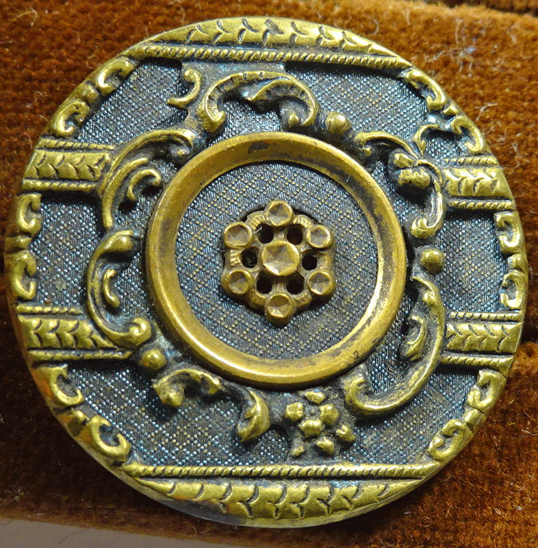 Pierced metal over textured green