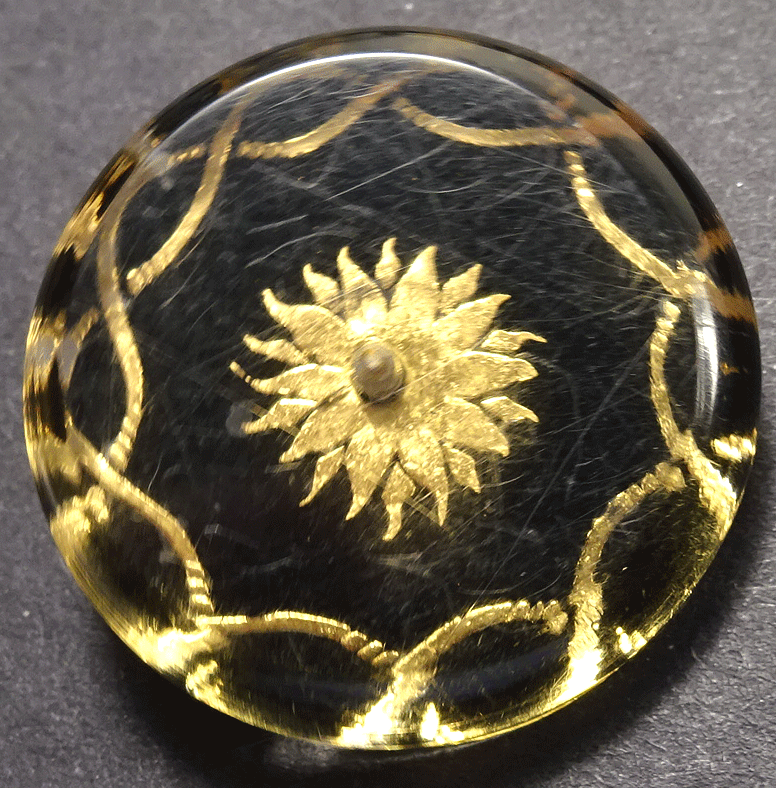 Clear lucite over black and gold