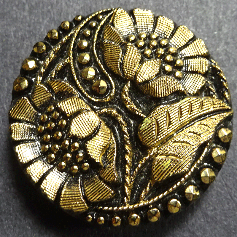 Gold lustre flowers on black glass