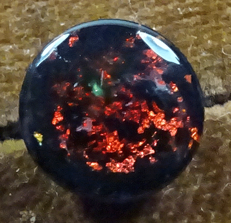 Red speckled waistcoat button