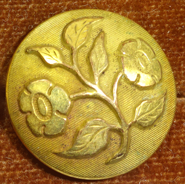 Gilt flower on Golden Age button