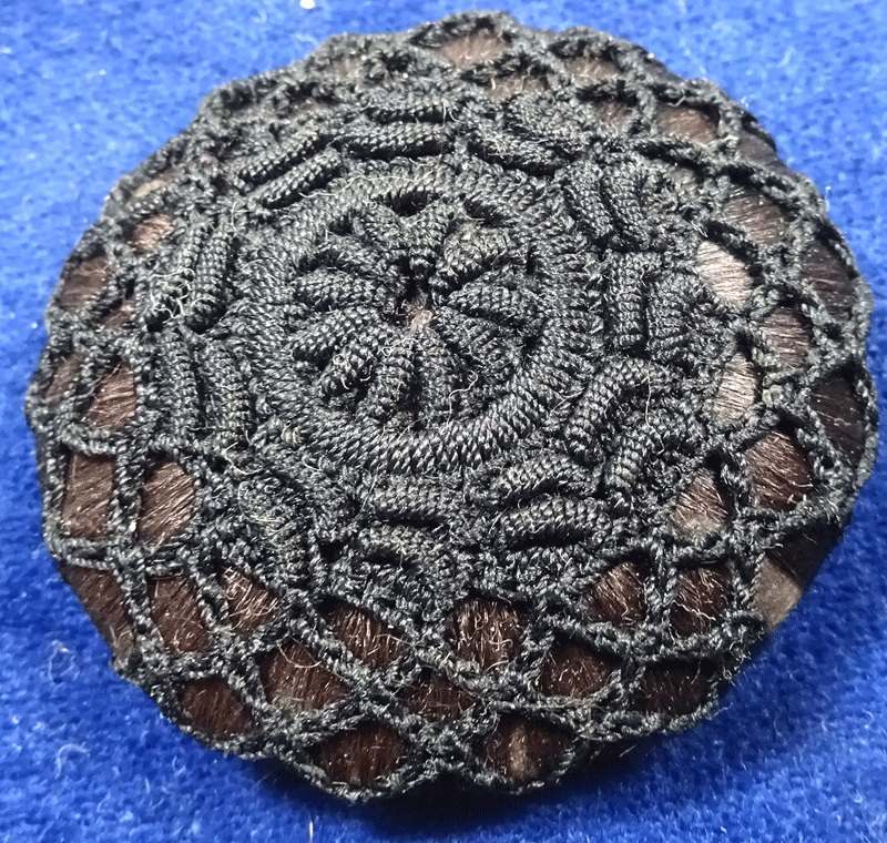 Large black crochet over wound purple