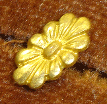 Small narrow gilt metal flower
