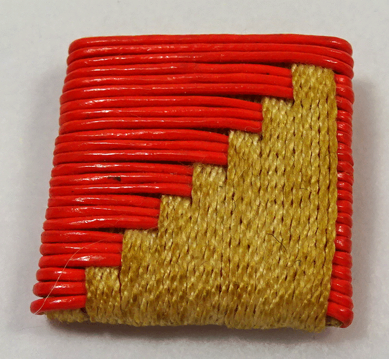 Woven red plastic and light brown ribbon