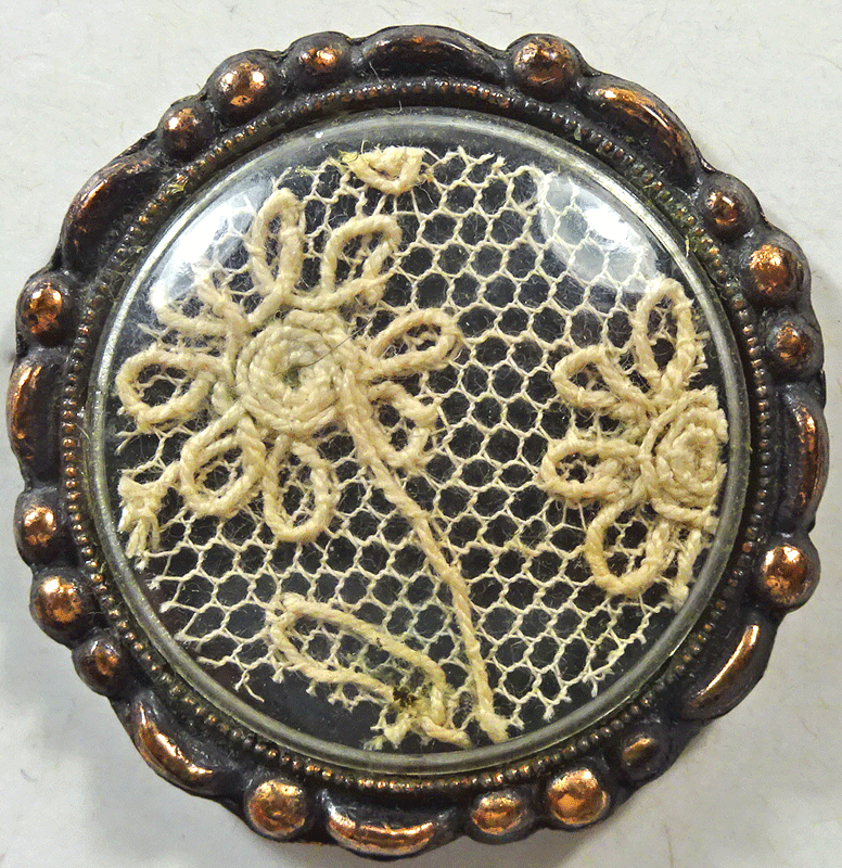 Lace under a celluloid shield