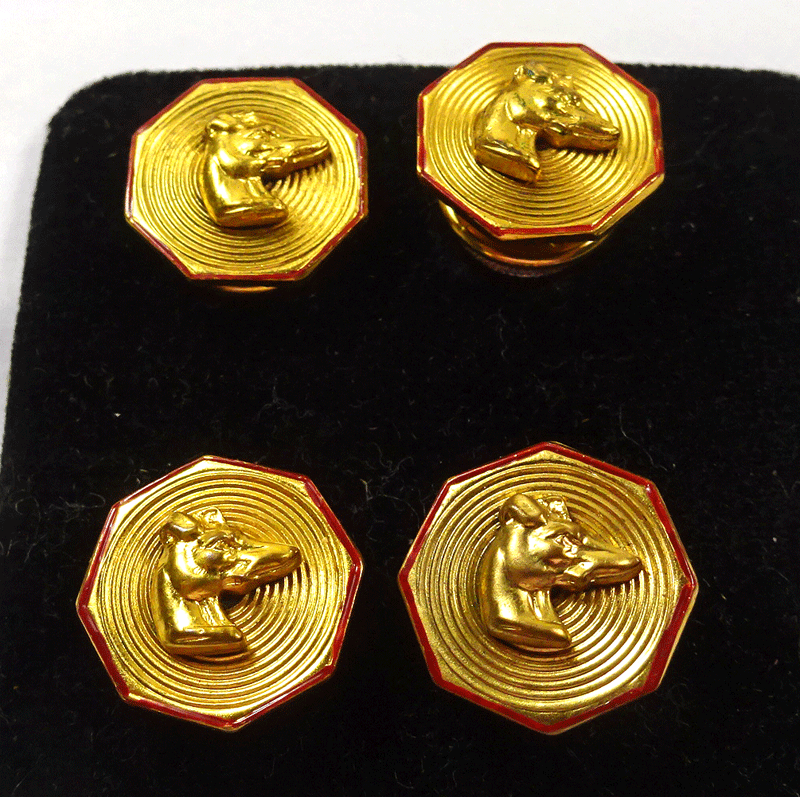 Boxed set of gilt metal dogs cuff links, octagonal red border