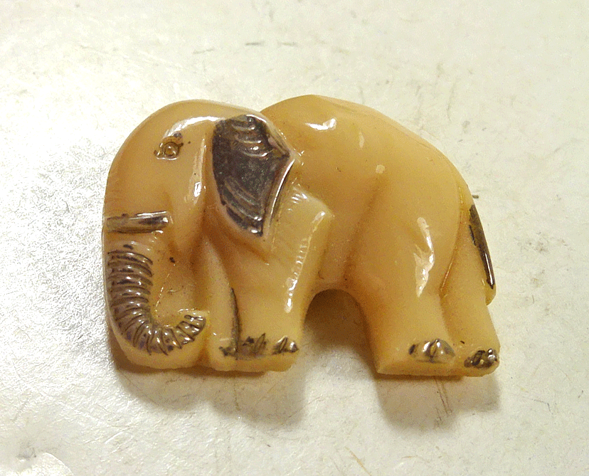 Small caramel glass elephant