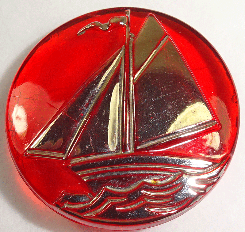 Silver yacht on red glass