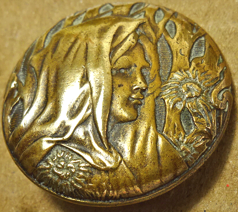 Stamped brass female head