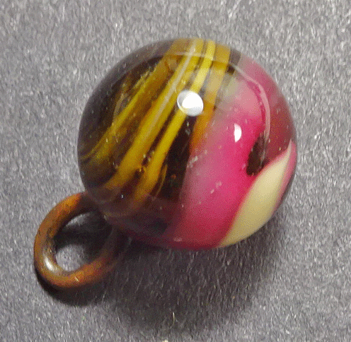 Small pink-brown swirly glass waistcoat ball