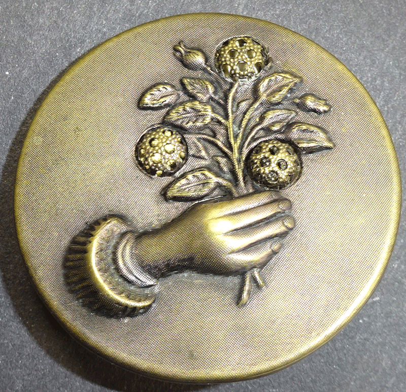 Right hand, holding flowers