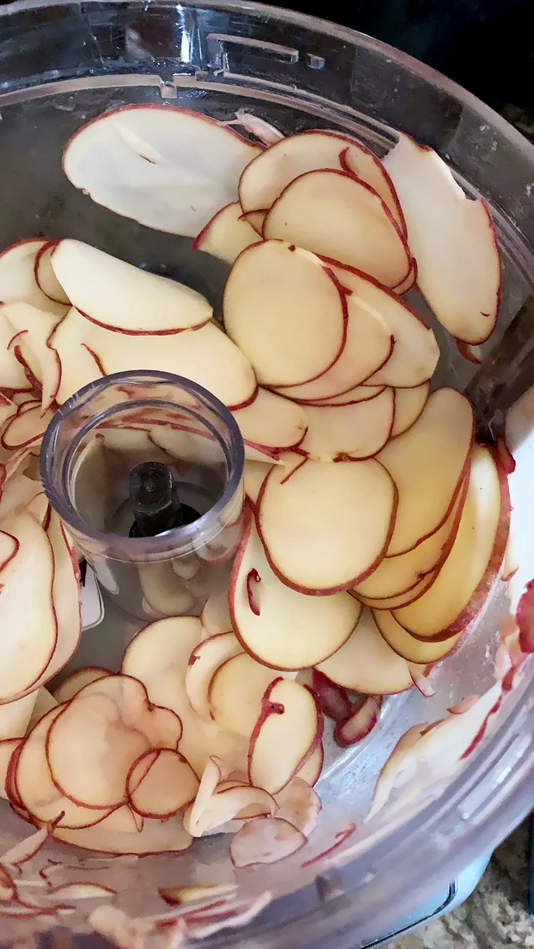 Using a food processor ensures your potato slices are as thin as possible.