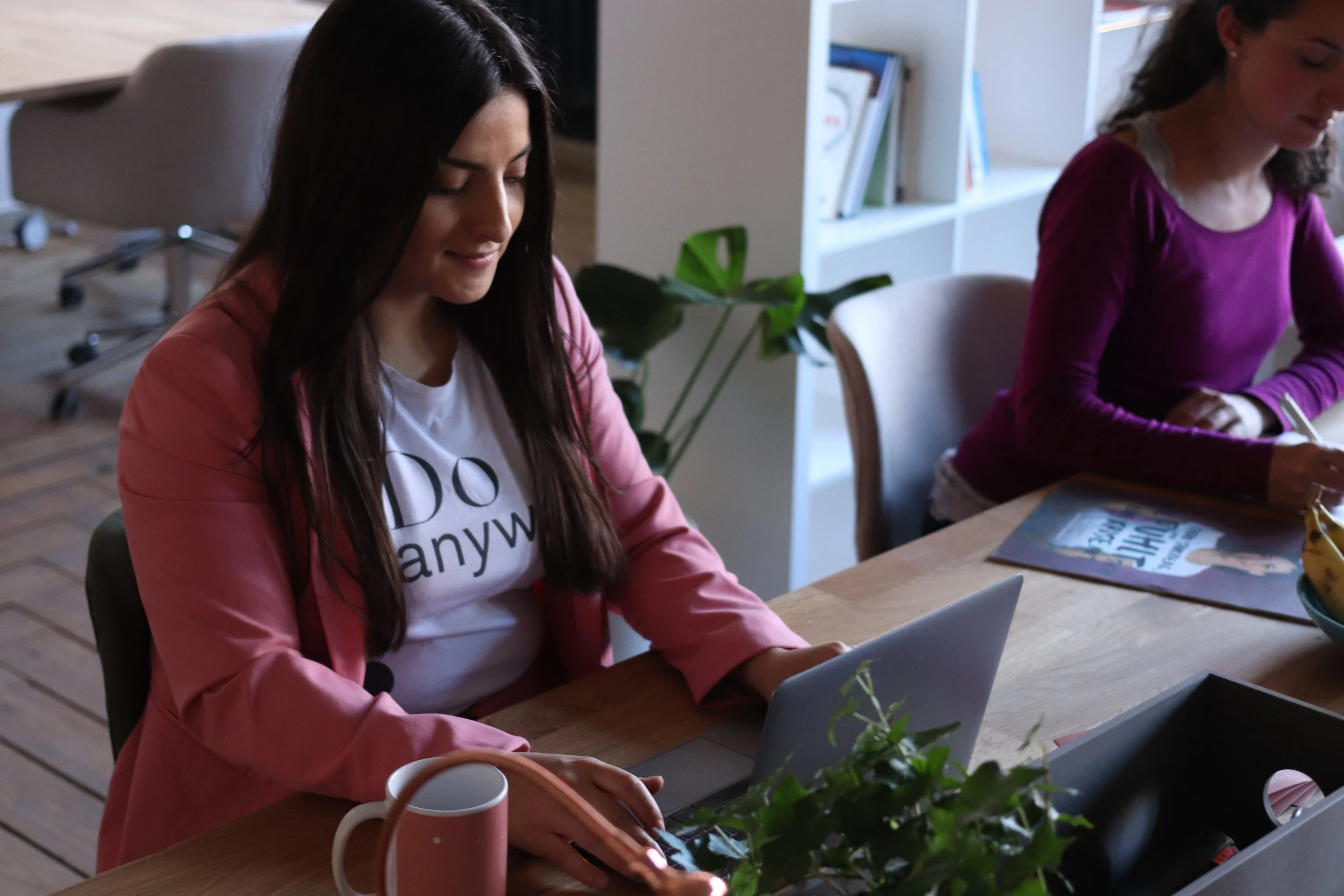 Two women working in an office environment.jpg