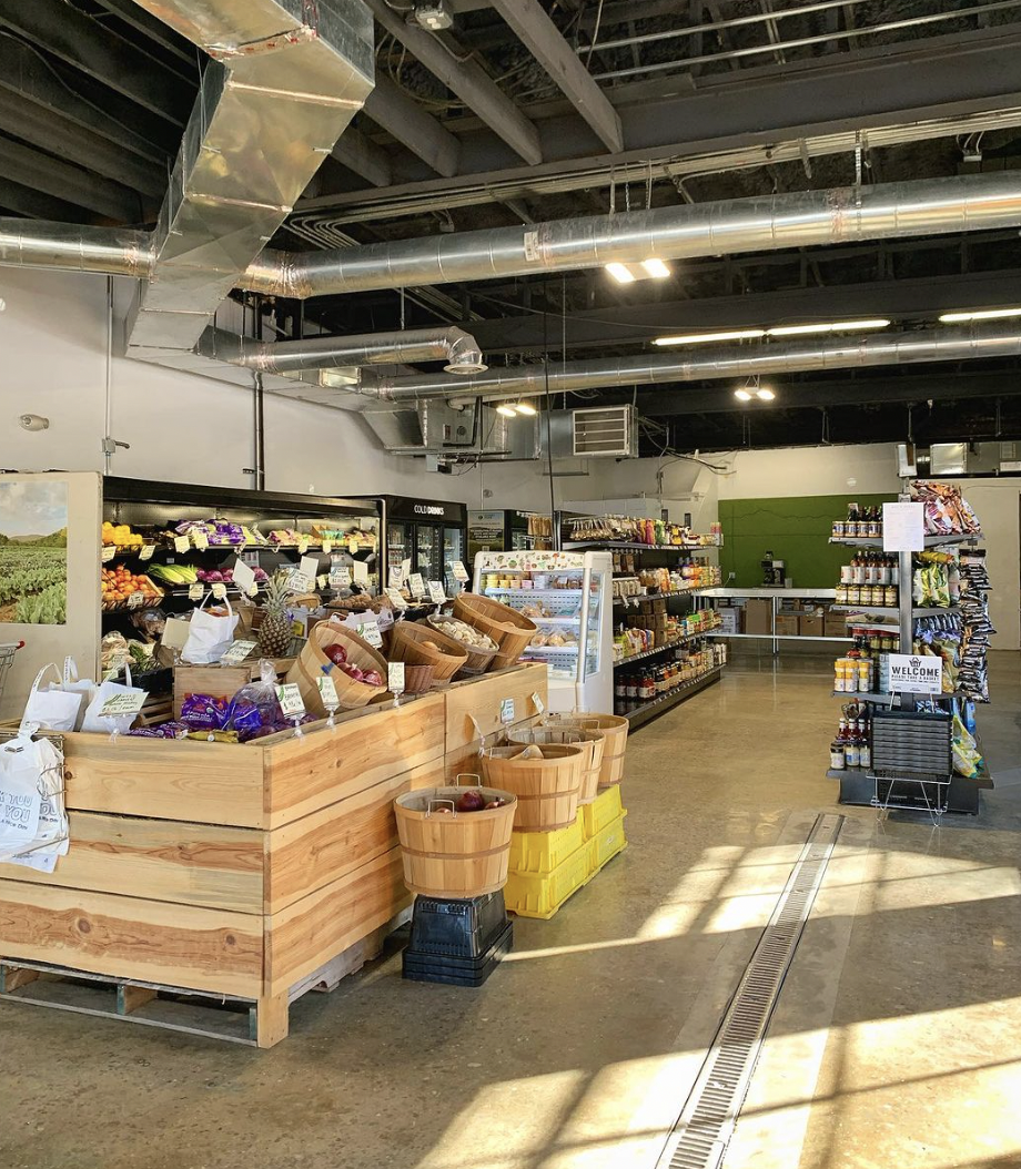 Warm bakery interior with natural light, wooden tables, and a welcoming neighborhood café atmosphere