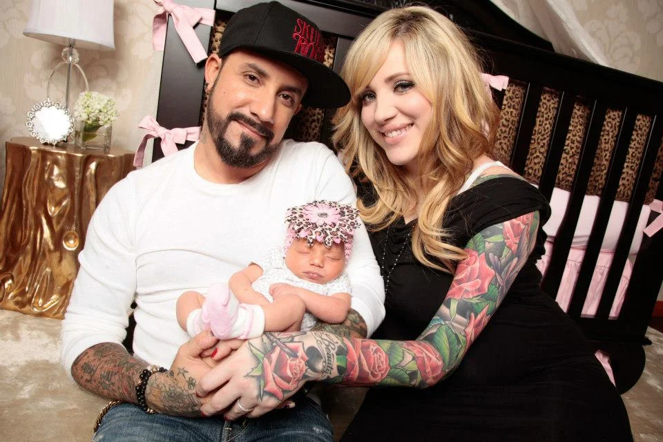 AJ & Rochelle McLean in their daughter Ava's nursery designed by Rockabye Mommy