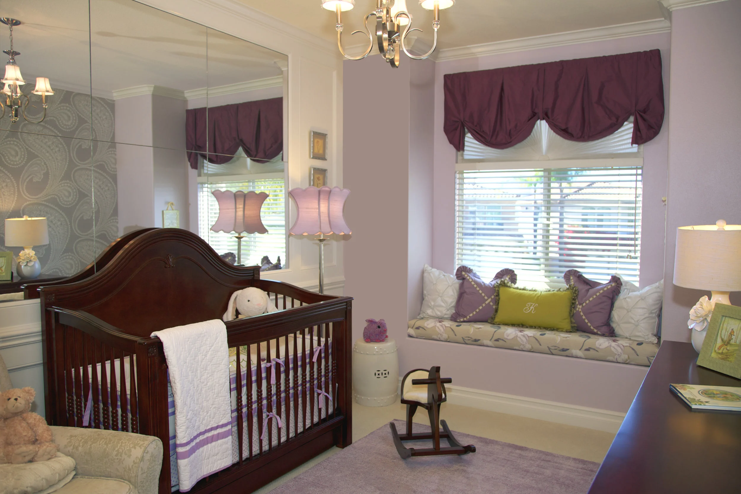 Mirrored wall in a Girl's Nursery designed by Rockabye Mommy