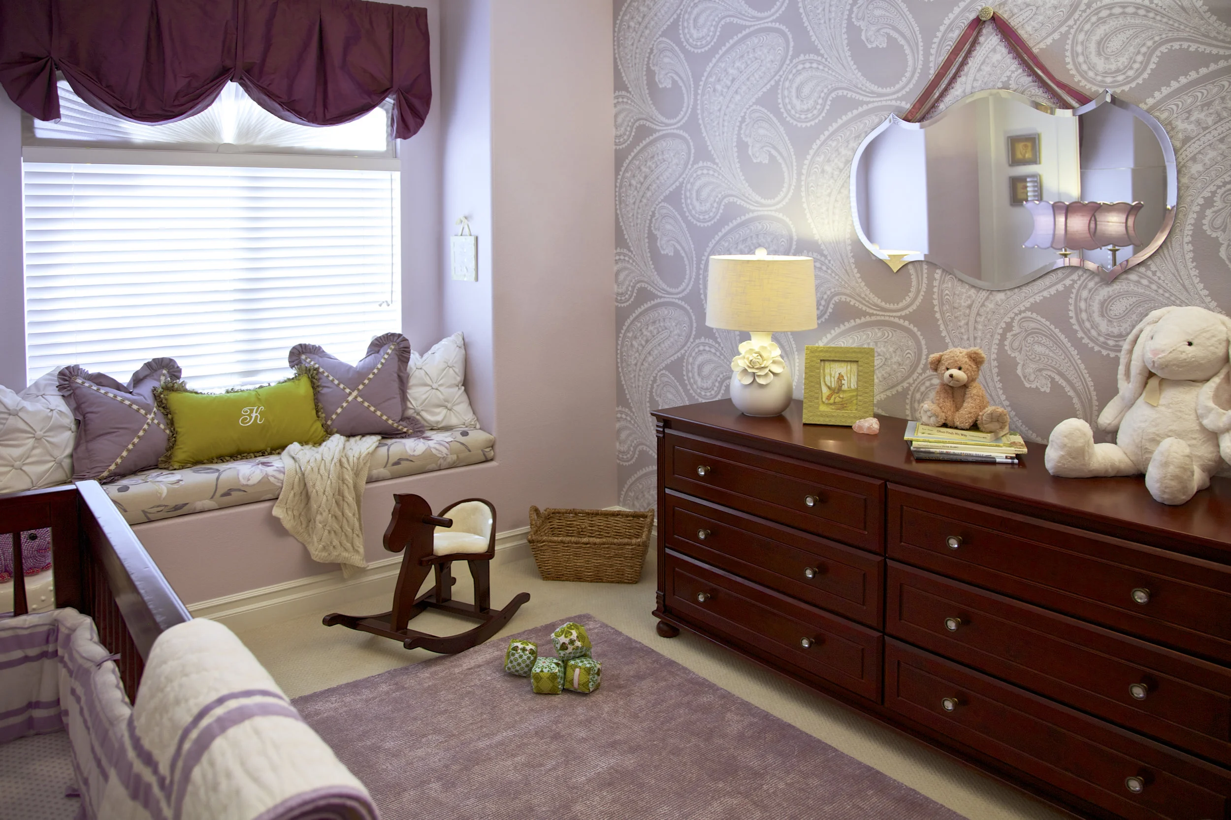 Paisley Wallpaper in a Girl's Nursery designed by Rockabye Mommy