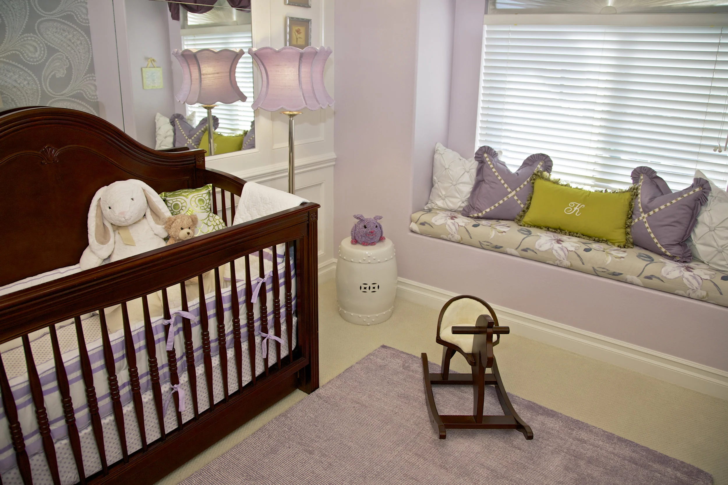 A Dark Walnut Stained Traditional Crib in Nursery designed by Rockabye Mommy
