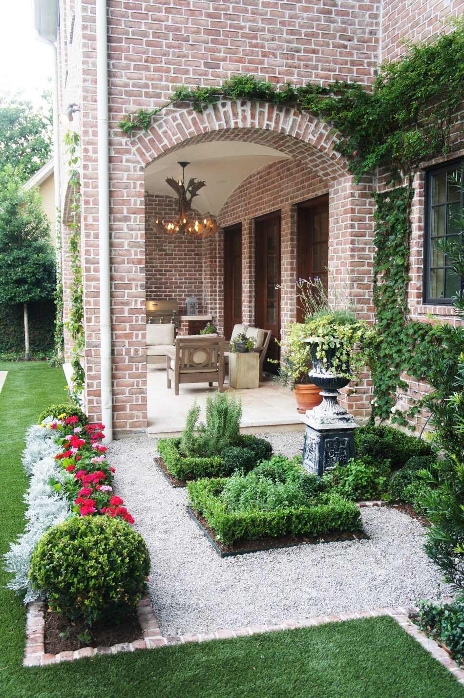 Seasonal herbs, such as rosemary, oregano, spearmint and lavender fill the parterre garden.
