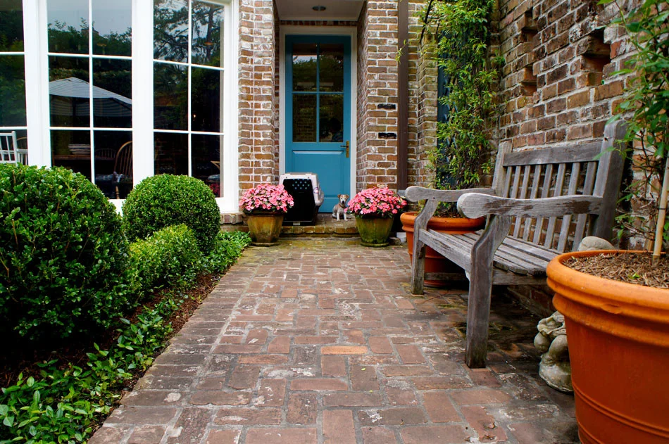 View of path leading from pool area to the gate.