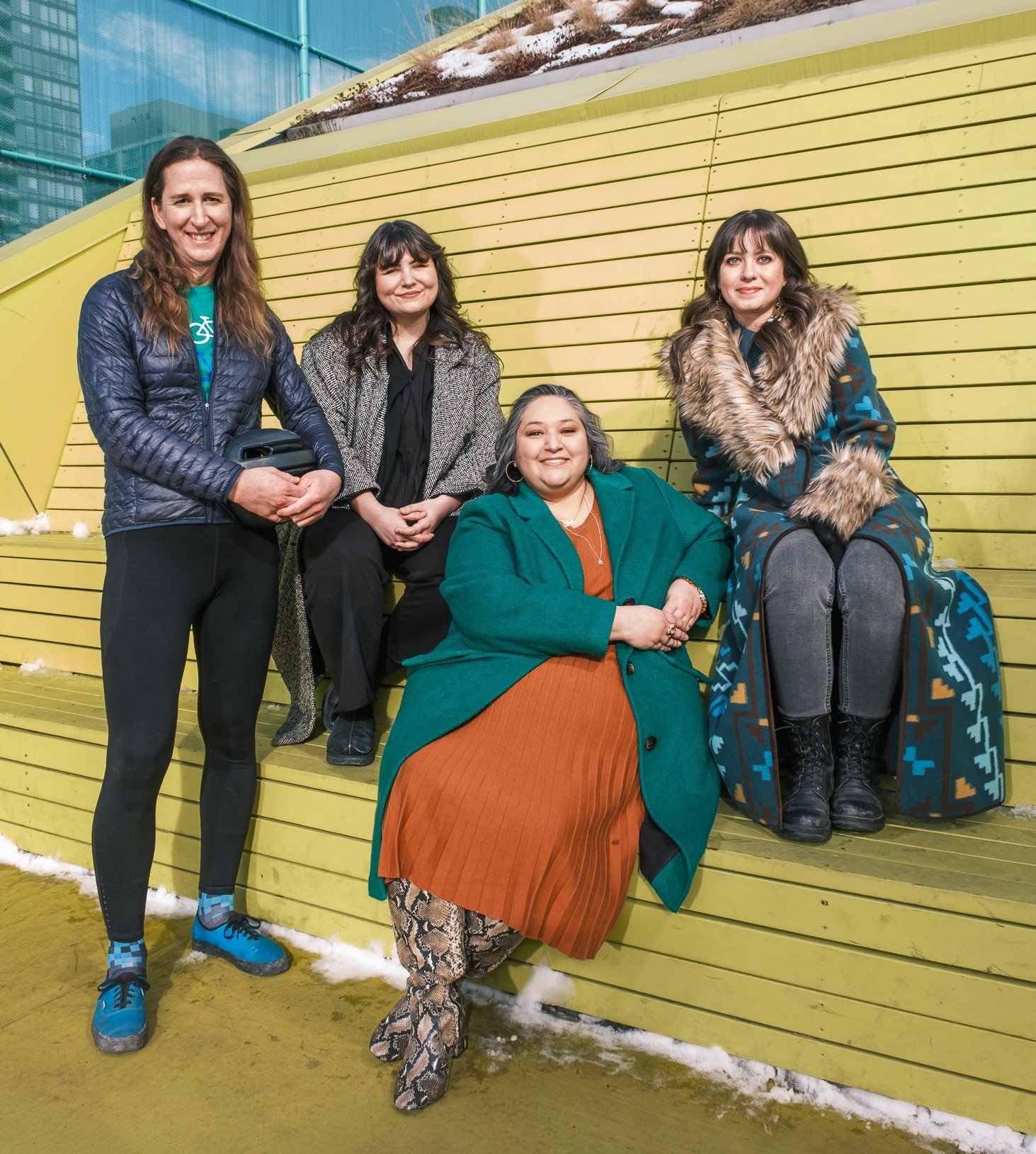 A group photo of the 2026 Exceptional Women of East Village photographed by Matt Wallace at The Open pickleball court. Pictured left to right: Brett Bergie, Bailey Dodds, Jehan Khan and Justine Giles.