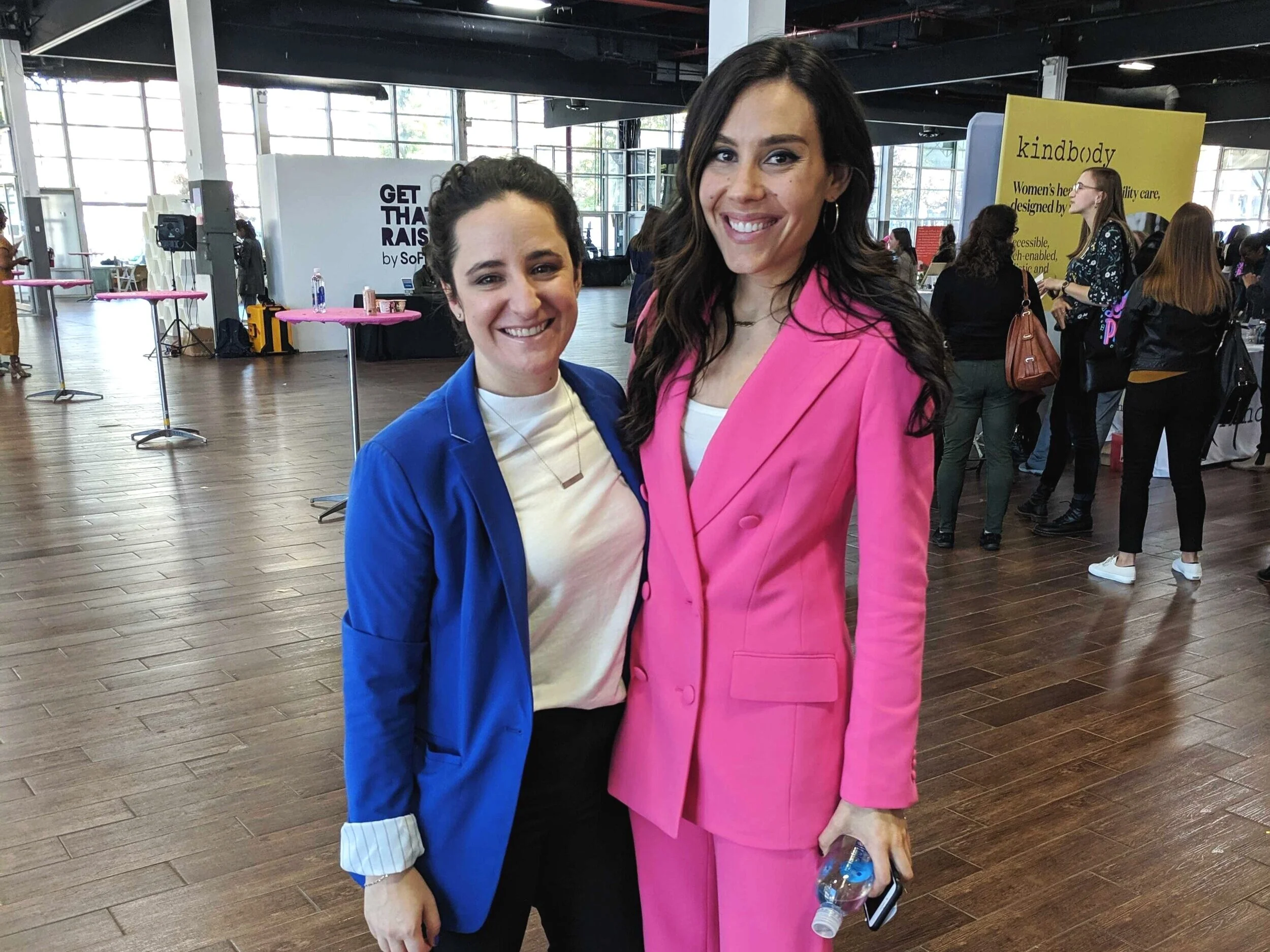 Claire Wasserman (pink) and her partner/co-founder Ashley Louise at Get Money, Get Paid.