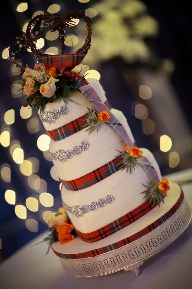 Ana Morrell (the baker) decorated the gorgeous wedding cake for the Morrisons in traditional Scottish tartan. The serving of cake is a highly anticipated social experience in British Culture.