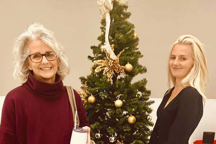 Lisa and Jennifer working on a sparkling tree