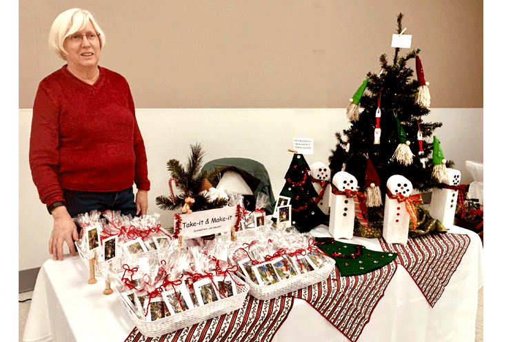 Kathy stands ready to show off the "Take it &amp; Make it" ornaments.