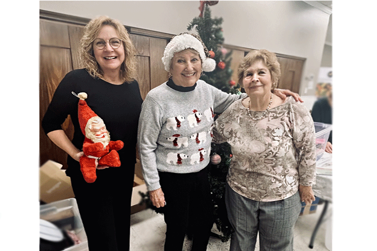 Lisa, Barb and Page, making it happen with their little friend, Nick. 