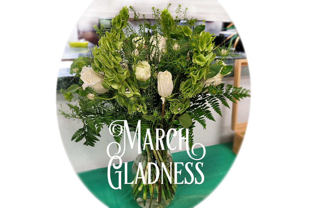 Bunny's Big Arrangement features Roses and Bells of Ireland