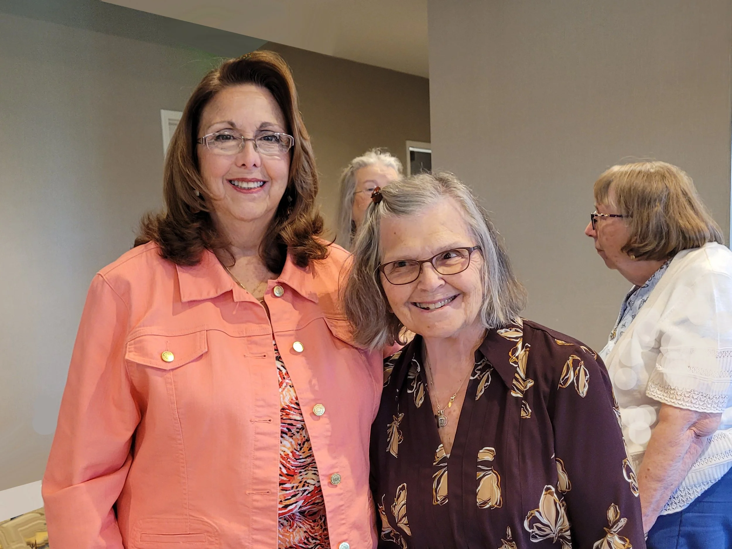 Our new Vice President, Janet, getting hugs from Kathy