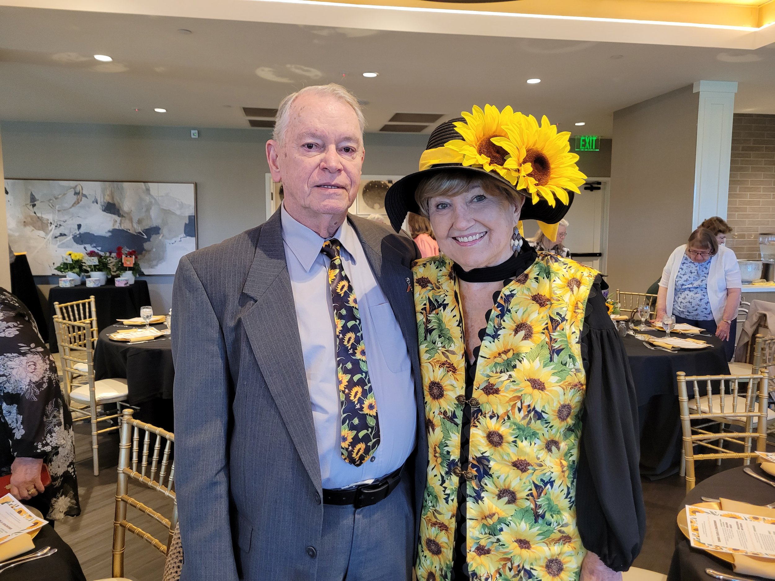 John, our new Treasurer wearing a "Sunny" tie, with Barbara sporting impessive sunflower attire.
