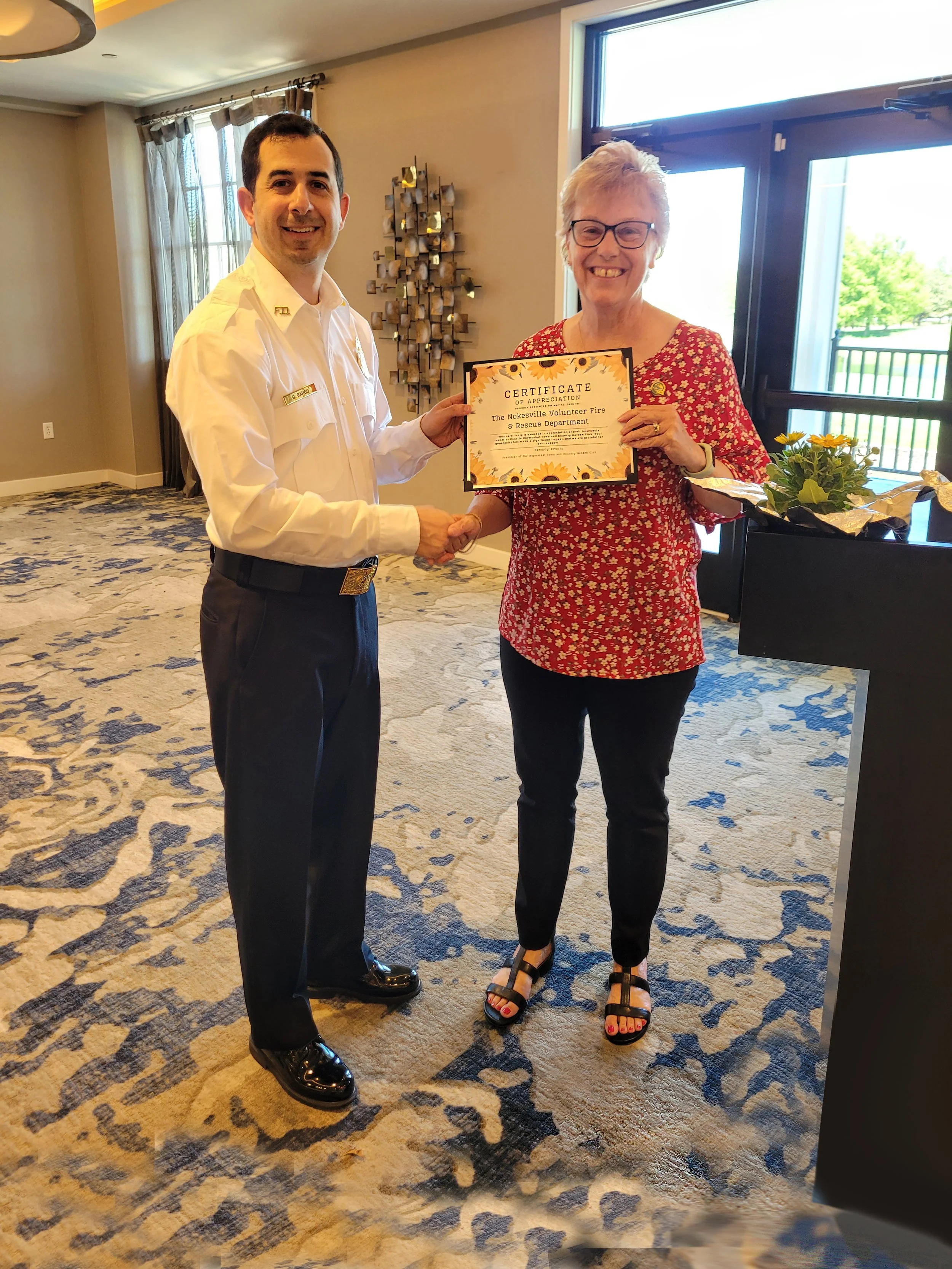 A "Certificate of Appreciation" goes to Nokesville Volunteer Fire and Rescue. Greg Bahou, President NVF&amp;R, accepts the accolade.
