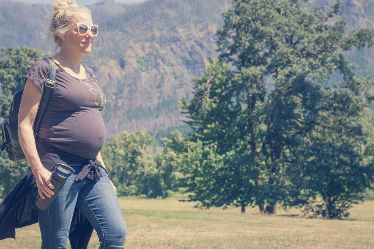 Attractive pregnant woman hiking in Columbia Gorge