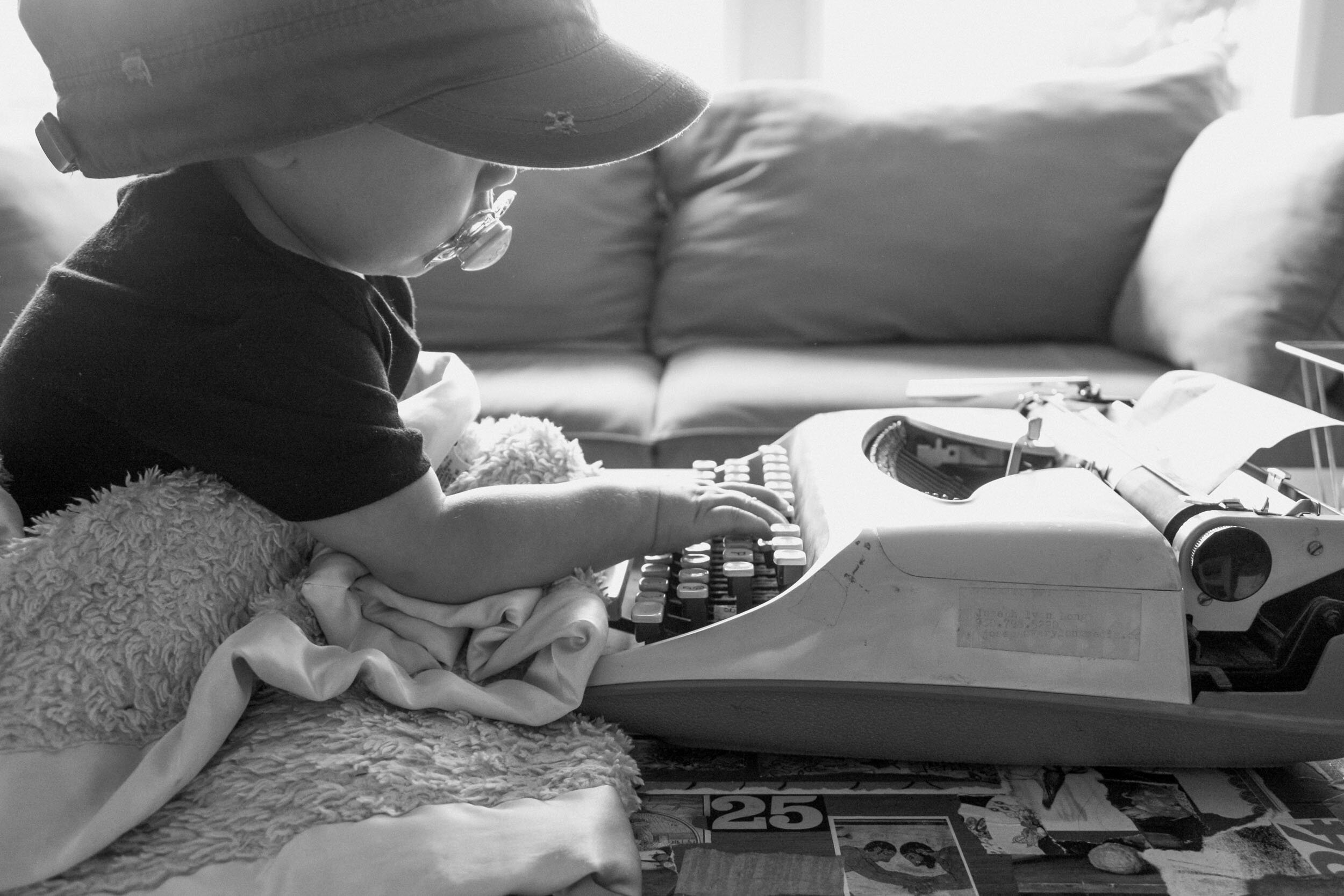 july 18 | living room SCHOOL - johannes typewriter on coffee table pink blanket3.jpg