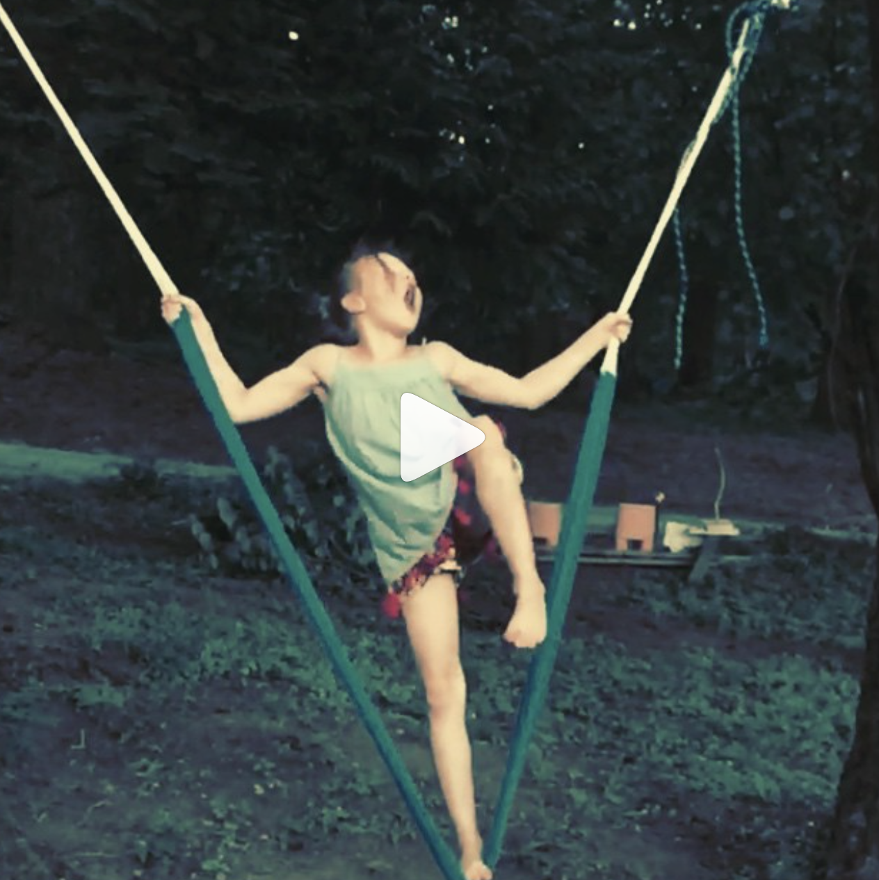 Girl in swing swinging to Muse.