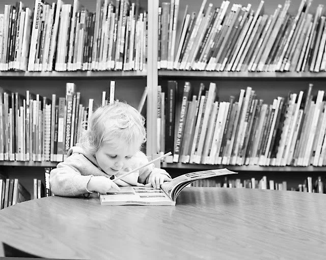 Library of Alexandria and a pictorial assault upon an unarmed two-armed uncle boy named Jonny.