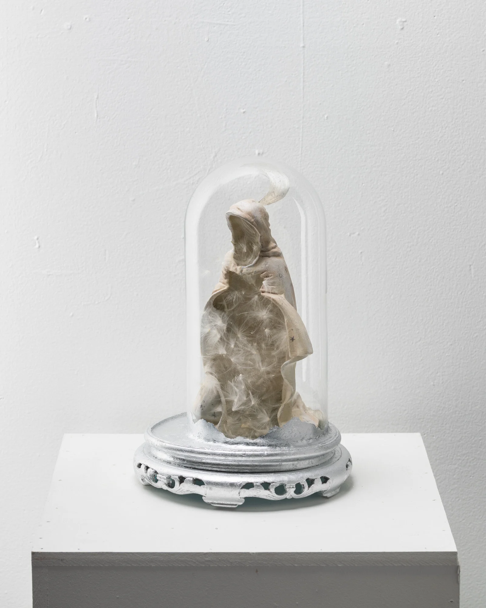  Found and altered objects (bell jar, wooden base, chalkware statue), milkweed silk with seeds removed, faux silver leaf, acrylic paint, graphite.  9” x 9” x 13”. 