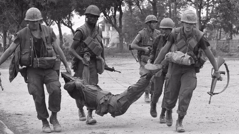 U.S. Marines drag casualty from street in Hue, Vietnam, Feb. 4, 1968. (Photo: Rick Merron)