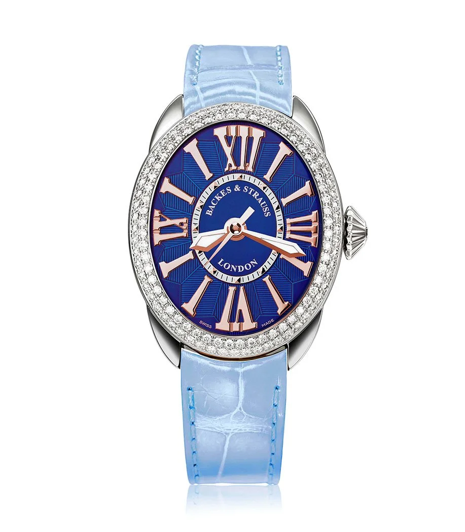 Elegant Regent 3238 ladies watch with blue dial, polished numerals, and diamond crown.jpg