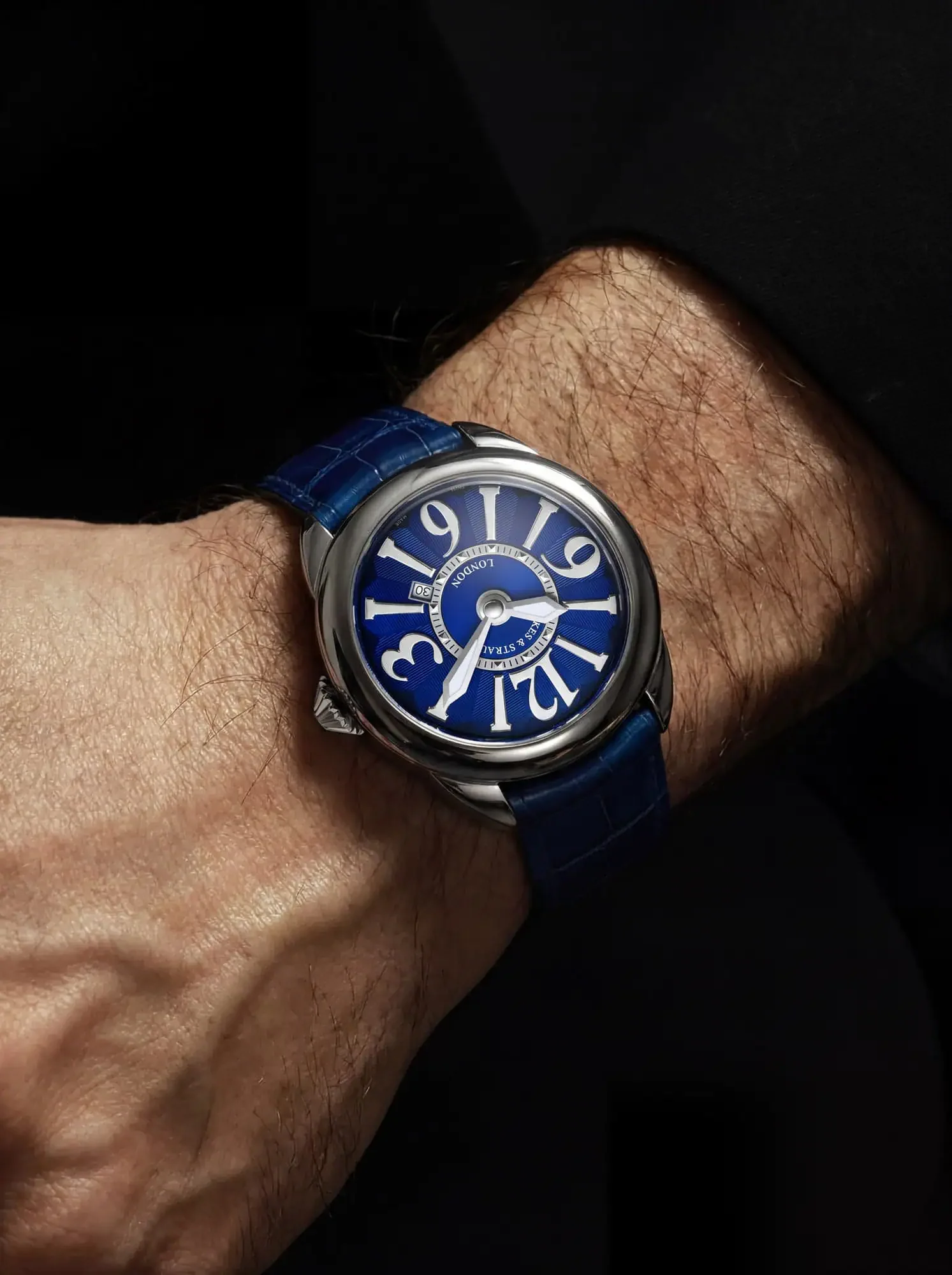 Piccadilly-45-mm-round-watch-with-the-blue-dial-on-the-male's-wrist-everyday-luxury.webp