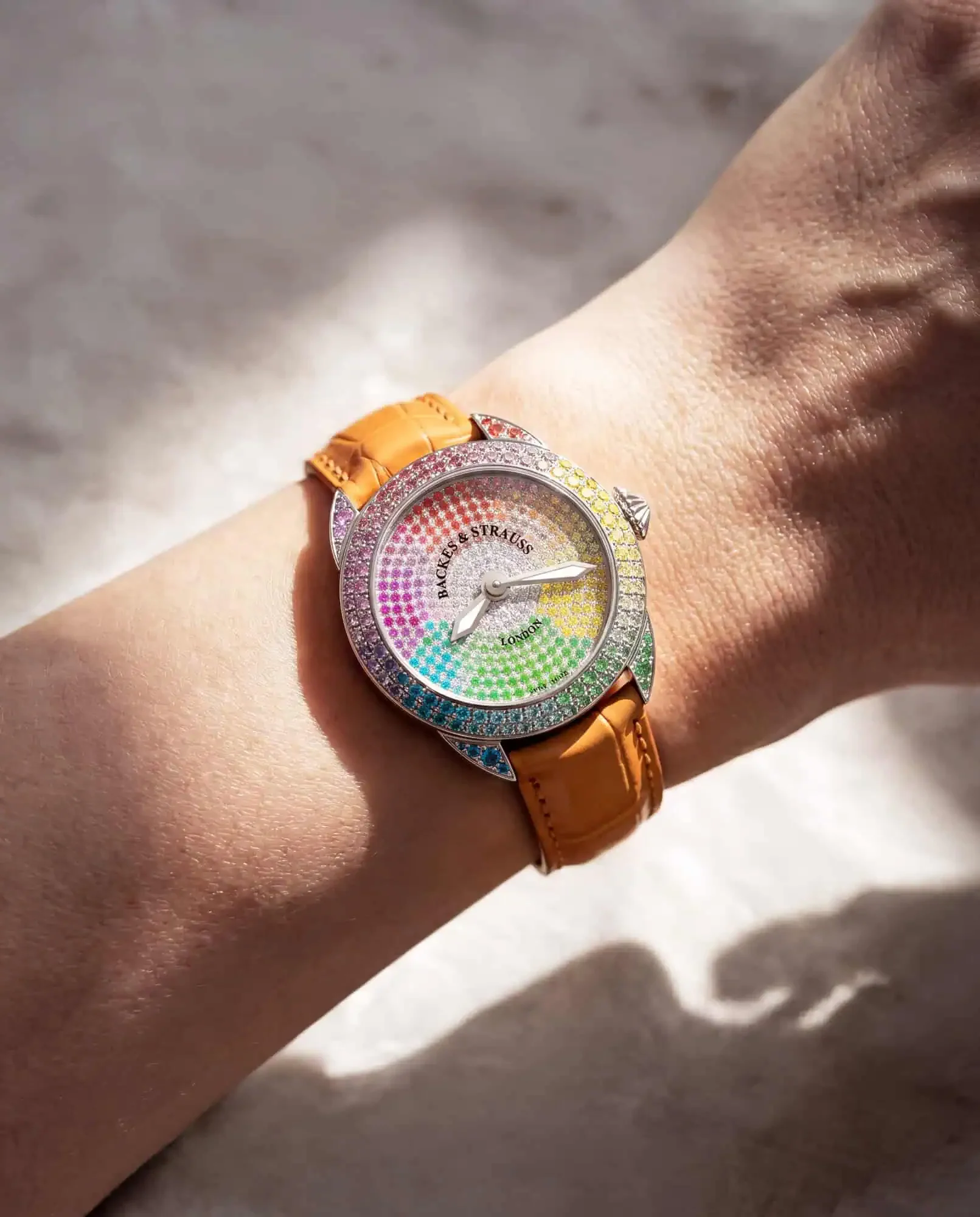 Ladies wrist shot of Piccadilly 33 Colour Cascade luxury diamond watch, fully gemstone-set case, dial, buckle, diamond crown.