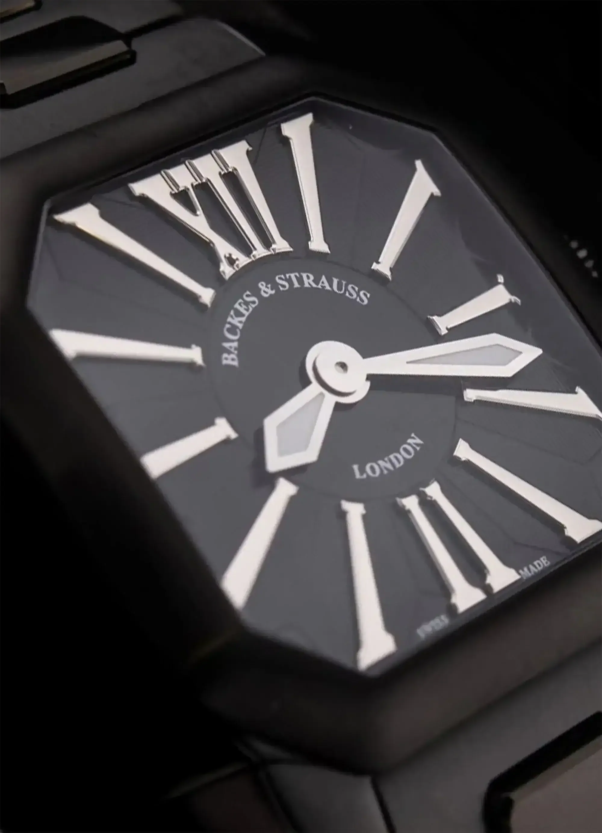 W1 PM stainless steel watch covered with the black PVD on the side with the black London inspired dial and square 40 mm case for everyday wear.webp