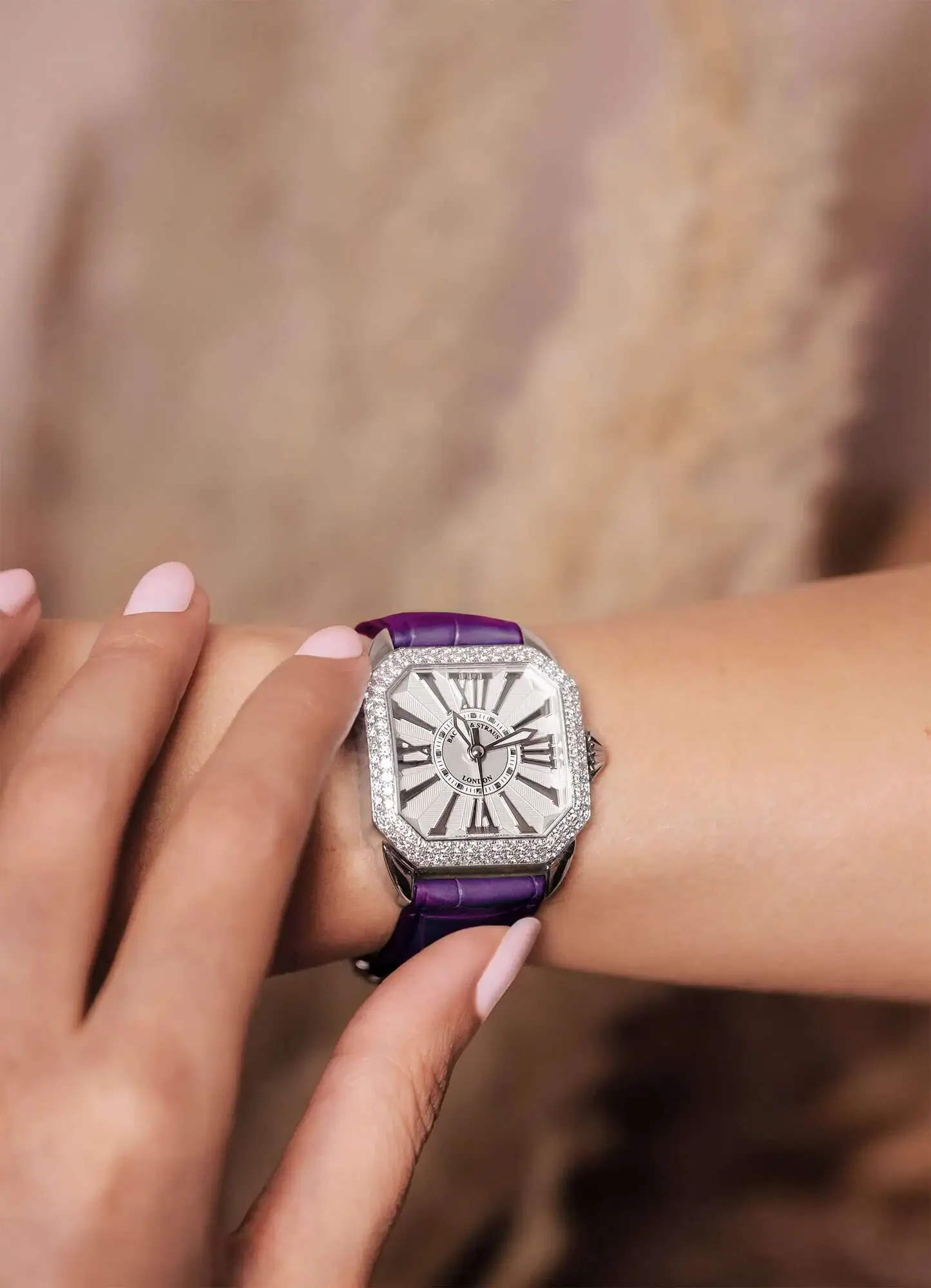 Detailed view of steel Berkeley square watch dial on female wrist and clean white dial.webp