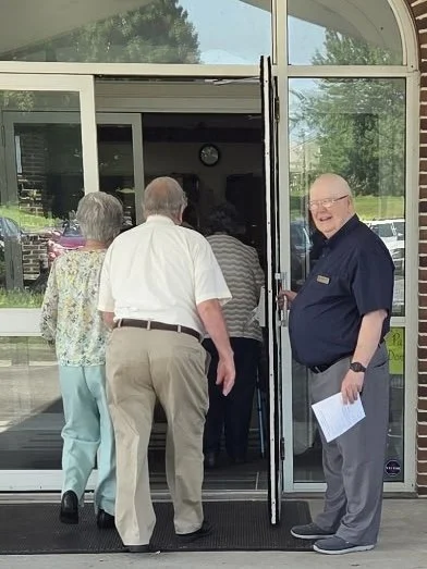 Visitors being welcomed at the entrance of Lampeter United Methodist Church in Lancaster, Pennsylvania